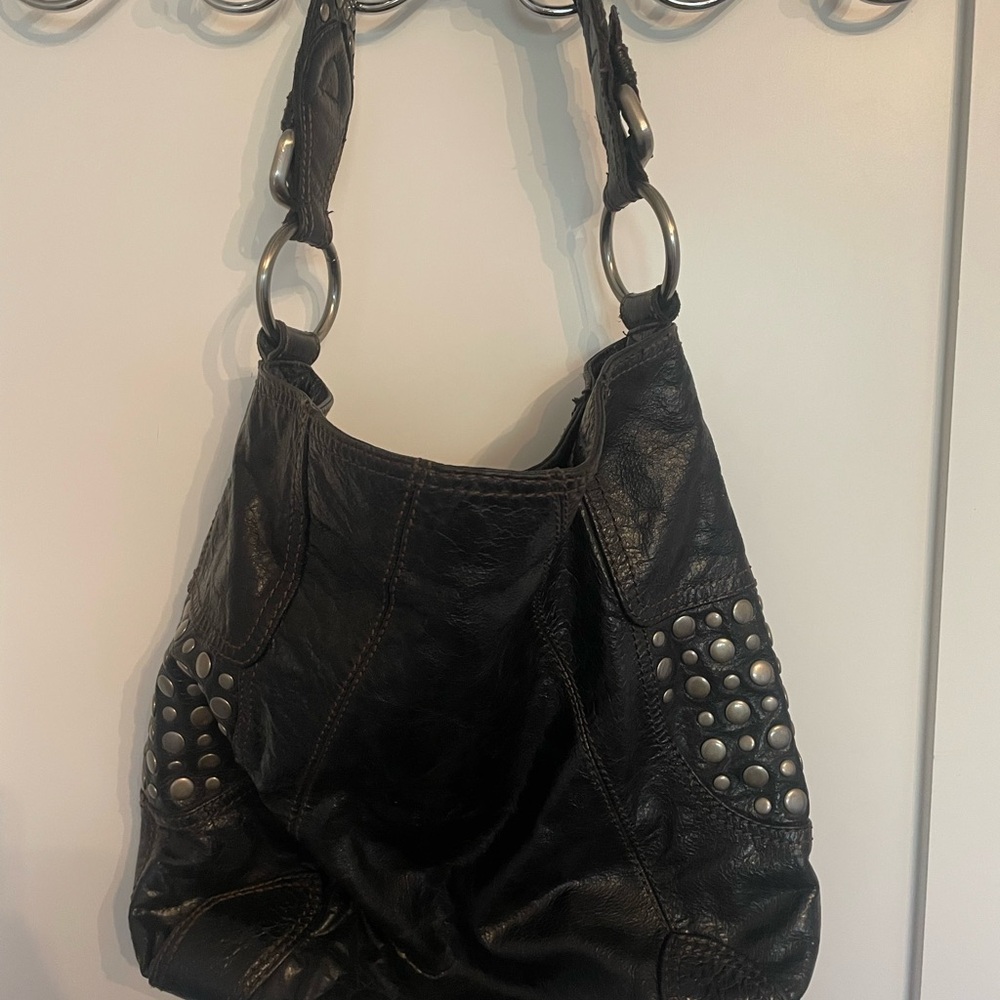 Steven by Steve Madden black leather shoulder bag with stud detail. 3 pockets.